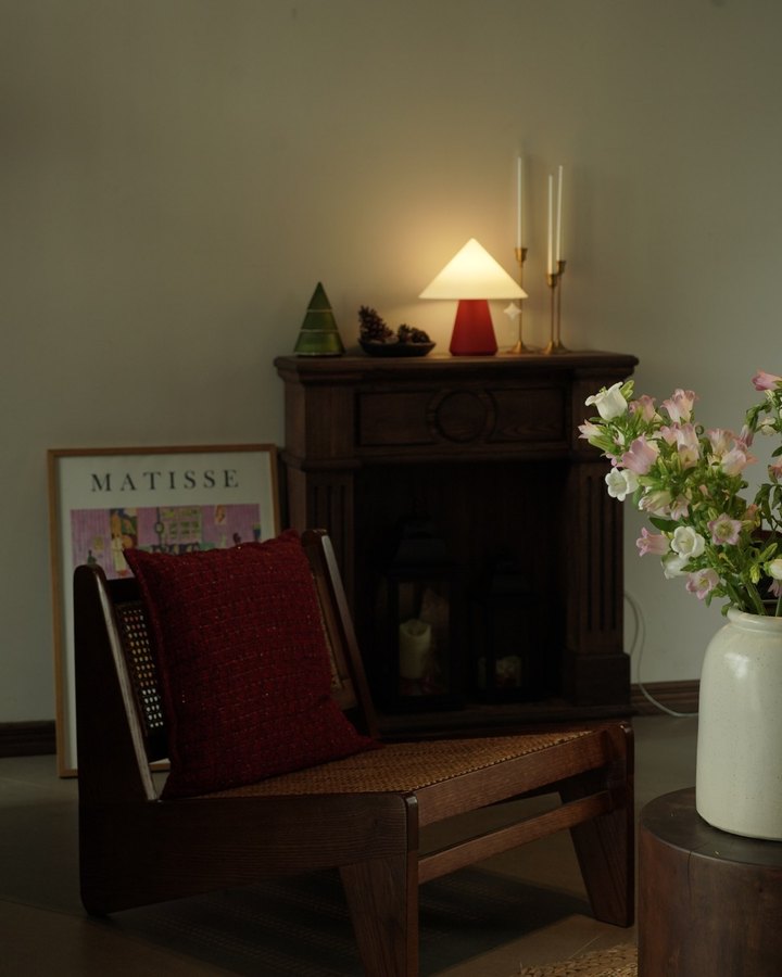 NOLA lamp beside fresh flowers on a quiet afternoon at home